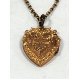 A HEART SHAPED LOCKET PENDANT, with 9ct gold back and front and the 9ct gold chain necklace, 18 1/2"