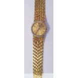 A MODERN 18ct GOLD PIAGET LADY'S WRIST WATCH, the circular bezel set with thirty diamonds, on an