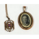 VICTORIAN ROLLED GOLD AND GLAZED OVAL DOUBLE SIDED PENDANT, enclosing a daguerreotype portrait of