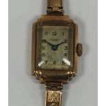 LADY'S ROTARY, SWISS 9ct GOLD WRIST WATCH, with small oblong silvered Arabic dial, in Art Deco style