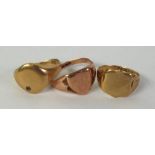TWO 9ct GOLD SIGNET RINGS, with shield shaped tops and ANOTHER WITH OVAL TOP, 11gms in total