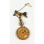 A LADY'S 14k GOLD FOB WATCH, with keyless movement, the gold Roman dial floral engraved, the case