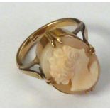 9ct GOLD RING, SET WITH AN OVAL SHELL CAMEO, carved with the head of a lady, fleur de lys pattern
