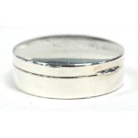 GEORGE V SILVER PILL BOX, retailed by A. Barratt and Sons, Piccadilly, circular with white glazed