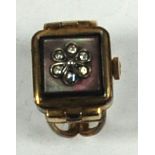 LADY'S DAMAS, SWISS ROLLED GOLD RING WATCH, with 17 jewel movement and paste set mother o'pearl