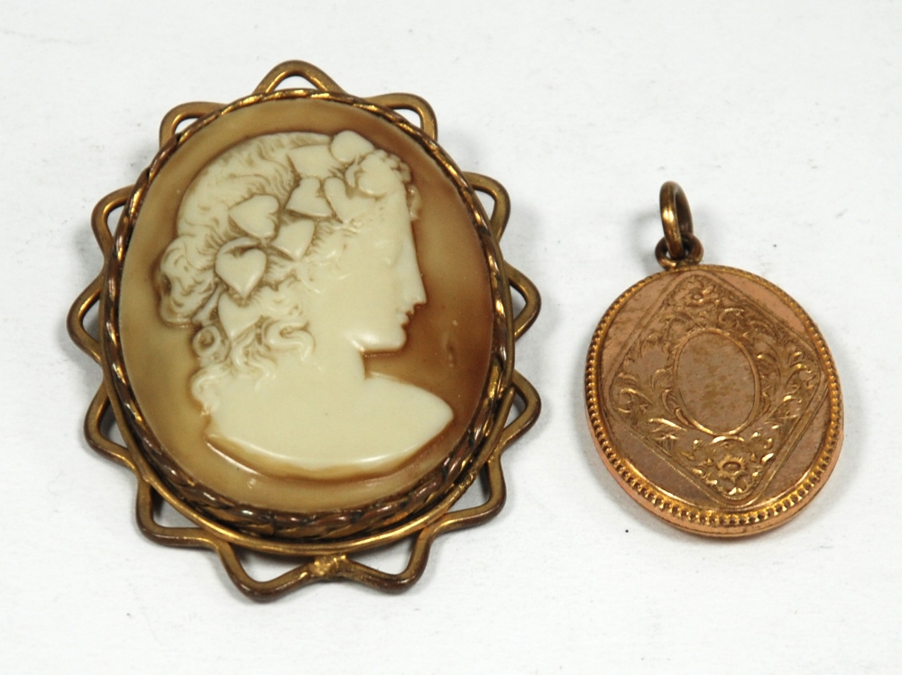 VICTORIAN OVAL SHELL CAMEO BROOCH, depicting a female head, in pinchbeck wavy edge frame, with