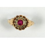 18 CT GOLD, RUBY AND DIAMOND CLUSTER RING, set with a circular centre ruby and surround of twelve