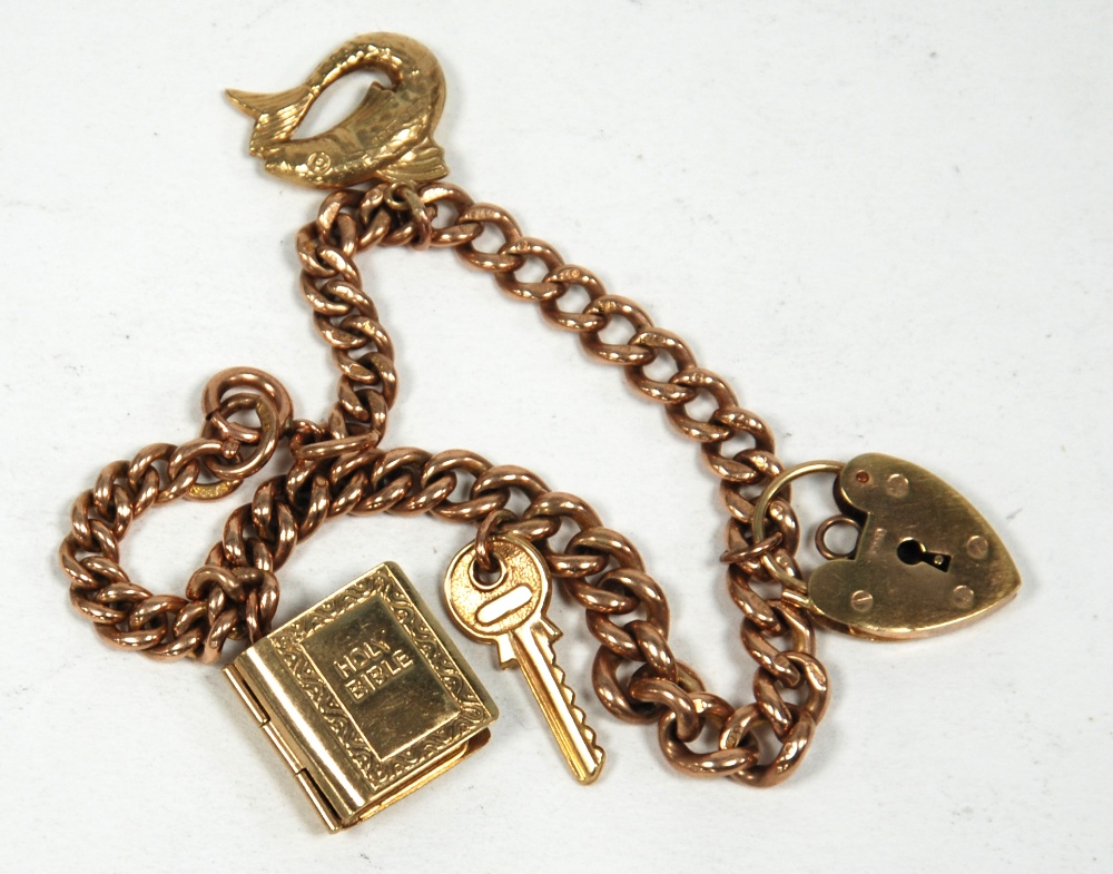 9ct GOLD CHARM BRACELET, with graduated curb pattern links ring clasp and four 9ct gold charms