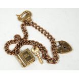 9ct GOLD CHARM BRACELET, with graduated curb pattern links ring clasp and four 9ct gold charms
