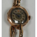 LADY'S 9ct GOLD WRIST WATCH, with Swiss movement, gilt circular Arabic dial, narrow 9ct gold