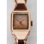 ENICAR WATCH CO., LADY'S 14K GOLD WRIST WATCH, with Swiss 17 jewel movement, bronze coloured