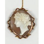 OVAL SHELL CAMEO BROOCH, well carved in high relief with a classical female head, in 9ct gold