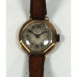 LADY'S PRE-WAR GOLD CASED WRIST WATCH, with leather strap, inscription to the back of the case (a.