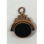 EDWARDIAN 9 CT GOLD REVOLVING FOB SEAL set with bloodstone and carnelian, Birmingham 1909, in