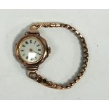 LADY'S 9K GOLD CASED PRE WAR WRIST WATCH, with circular white porcelain dial and expanding gold