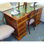 MODERN YEW WOOD VENEERED TWIN PEDESTAL DESK, with three gilt tooled 'antique' green leather