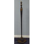 A BLACK LACQUERED AND FLORAL DECORATED WOODEN STANDARD LAMP WITH HEXAGONAL BALUSTER COLUMN AND