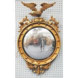 NINETEENTH CENTURY STYLE CARVED GILT WOOD CONVEX WALL MIRROR, the circular plate in a reeded