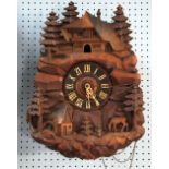 A LATE 19TH CENTURY BLACK FOREST/SWISS CARVED WOODEN CASED CUCKOO CLOCK with three train movement