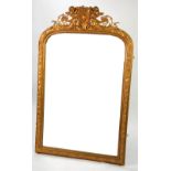 VICTORIAN GILT GESSO OVERMANTLE MIRROR, the milestone shaped plate in a moulded frame with elaborate