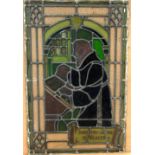 A CIRCA 1900 LEADED STAINED GLASS WINDOW, depicting a draughtsman with compass in hand, inscribed in