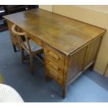 CIRCA 1940's OAK KNEEHOLE DESK, WITH SEVEN DRAWERS AND PULL OUT SLIDES AND AN OAK SINGLE CHAIR (2)