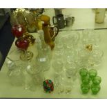 A QUANTITY OF GLASSWARES TO INCLUDE; AN OIL TABLE LAMP, DECANTERS, JUGS ETC......