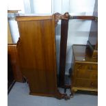 A MAHOGANY 4'6" PANEL BEDSTEAD WITH ARCHED HEAD AND FOOT BOARDS, ON ACANTHUS CARVED STUMP CABRIOLE