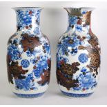 PAIR OF LATE NINETEENTH CENTURY CHINESE CLOBBERED BLUE AND WHITE PORCELAIN VASES, of Indian club