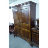 LATE NINETEENTH CENTURY MAHOGANY HANG WARDROBE, ENCLOSED BY TWO FRAMED PANEL DOORS, ON OGEE