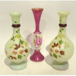 A PAIR OF WHITE OPAQUE GLASS LONG NECKED VASES, PAINTED WITH FLOWERS AND A PINK AND FLORAL GLASS