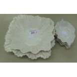 A SET OF THREE LIMOGES WHITE SWEET MEAT DISHES AND TWO SUTHERLAND WHITE CHINA WAVY FLUTED SQUARE