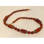 SIMULATED AMBER BEAD NECKLACE with metal decoration separators, 23" long
