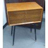 CIRCA 1960's TEAKWOOD THREE DRAWER CUTLERY CANTEEN WITH RECESSED END HANDLES AND RAISED ON