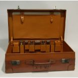 GOOD QUALITY 1940s LEATHER FITTED SUITCASE containing six toilet jars and bottles with engine turned