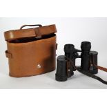 A PAIR OF LEATHER CASED BINOCULARS, a moulded composition rectangular PLAQUE after Leonardo's last