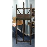 AN INTER-WAR YEARS HARDWOOD ARTIST'S EASEL with height adjustable canvas support, 76" (193cm)