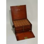 EARLY 20TH CENTURY COIN COLLECTORS MAHOGANY CABINET having twelve stacking trays cut to receive