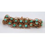 TURKISH GOLD COLOURED METAL BROAD WIRE PATTERN BRACELET set with two rows of pale blue turquoise