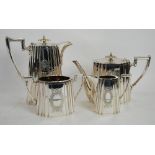 FOUR PIECE ELECTROPLATED TEA SET, by Walker and Hall of shaped oval form with angular scroll handles