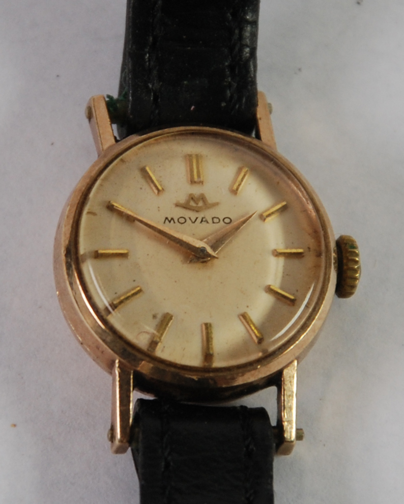 LADY'S MOVADO SWISS 9ct GOLD WRIST WATCH, with 17 jewel movement, small circular silvered dial