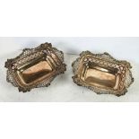 A PAIR OF LATE VICTORIAN SILVER OBLONG BON BON DISHES with pierced sides and elaborate shaped