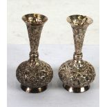 PAIR OF INDIAN SILVER COLOURED METAL SMALL VASES, globe and shaft shaped with trumpet shaped neck,
