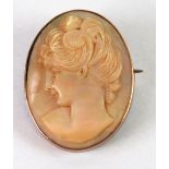 OVAL CARVED MOTHER O'PEARL CAMEO BROOCH, depicting the head of a young woman in plain 9ct gold