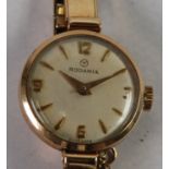 LADY'S RODANIA SWISS 9ct GOLD WRIST WATCH, with mechanical movement, circular silvered dial,