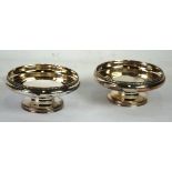 A PAIR OF SILVER CIRCULAR PEDESTAL DISHES with beaded low gallery tops, bulbous sides, on short