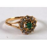 LATE VICTORIAN 18ct GOLD, EMERALD AND DIAMOND CLUSTER RING, with a raised centre square cut