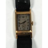 GENTS CYMA 9ct GOLD CASED WRIST WATCH, with oblong face and leather strap, hallmarked Birmingham