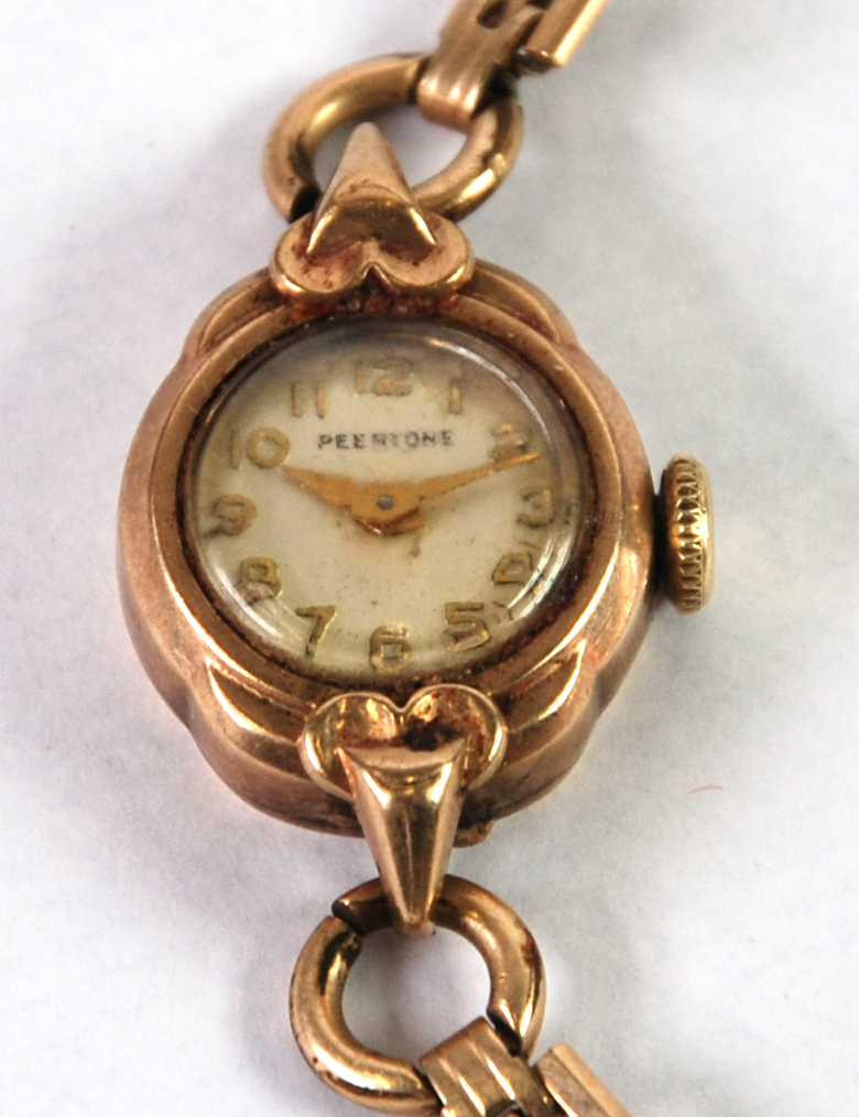 LADY'S PEERTONE, SWISS 9ct GOLD WRIST WATCH, mechanical movement, small circular Arabic dial and the