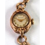 LADY'S PEERTONE, SWISS 9ct GOLD WRIST WATCH, mechanical movement, small circular Arabic dial and the